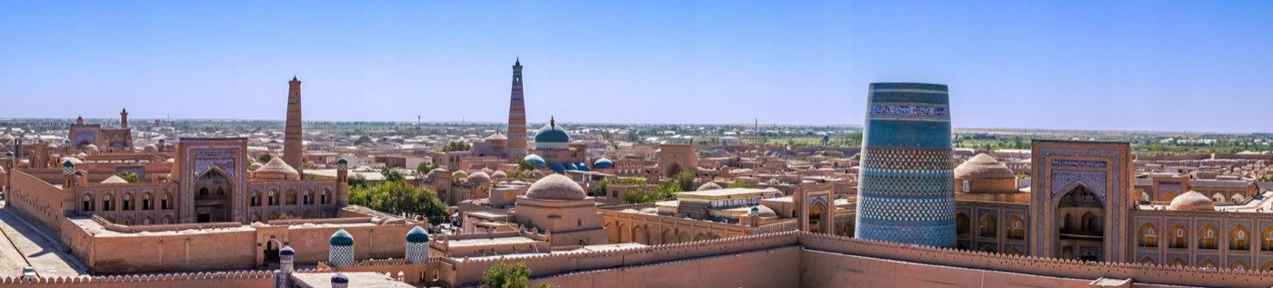 The old city skyline of Khiva, Uzbekistan, with turquoise-tiled minarets
